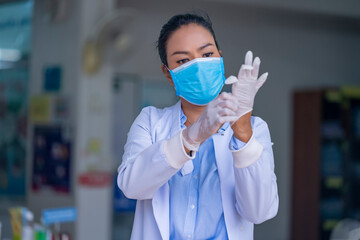 Doctor or nurses showing how to wearing face mask and Medical gloves