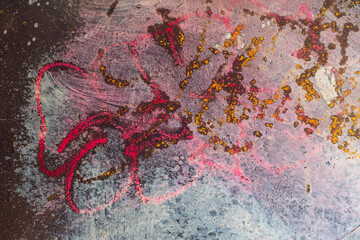 Fototapeta premium An abstract texture in red, gold, and pink