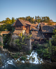 waterfall by old houses