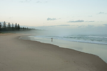 beach fishing on a misty morning 