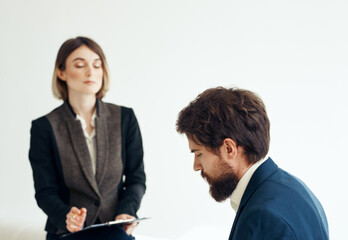 Woman and man in a jacket on a light background job interview