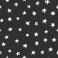 White stars on a black background. Vector illustration. Seamless Pattern. Simple. Textile, paper design. Childish clothes. 