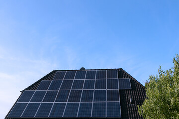 Obraz premium solar plant on a roof, copy space