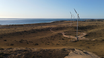 Wind turbines at sunset aerial shot renewable energy