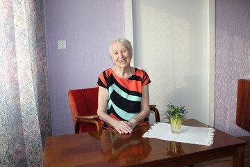 The portrait of a cheerful senior woman