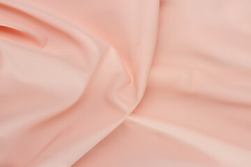 Silk pink fabric with a draped waves