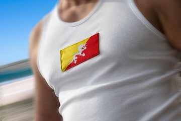 The national flag of Bhutan on the athlete's chest