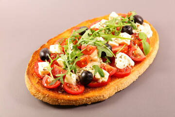 bruschetta with tomato,  mozzarela and basil