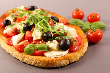 bruschetta with tomato,  mozzarela and basil