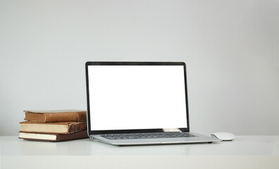 Modern workspace with computer with blank screen and equipment on white table.Blank screen for your information.