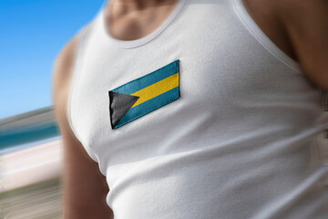 The national flag of Bahamas on the athlete's chest