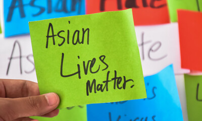 Word card 'Asian Lives Matter.' holding in hand, concept for calling all people around the world to...