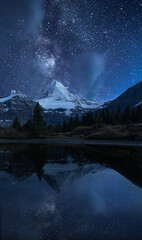 Fototapeta na wymiar Mount Assiniboine under the star sky. Mount Assiniboine Provincial Park in British Columbia, Canada, this park was included within the Canadian Rocky Mountain Parks UNESC
