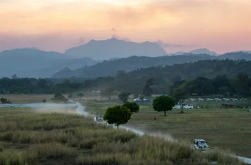Foto op Canvas Picturesque Evening in the Tropics: Dirt Road, Expansive Fields, and Jagged Mountains outside Clark, Pampanga, Philippines © Nate Hovee