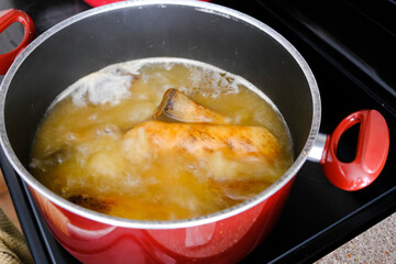 Nigerian cow skin or ponmo boiling in a pot