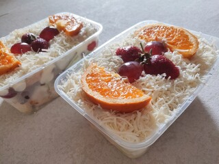 Naklejka na ściany i meble Fruit Salad With Cheese, Strawberry, Grape and Orange in Plastic Container.