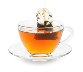 Taking tea bag out of glass cup with hot beverage on white background
