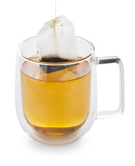 Taking tea bag out of glass cup with hot beverage on white background