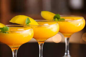 Glasses of tasty mango margarita, closeup