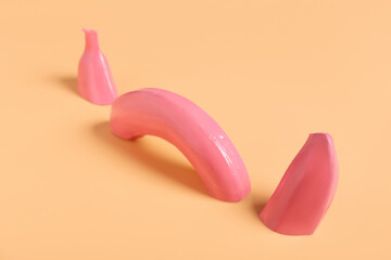 Creative composition with painted banana on color background