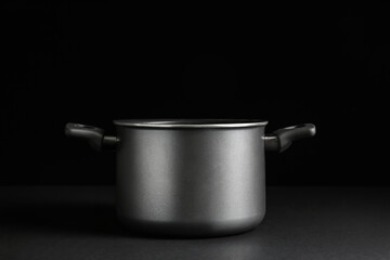 Cooking pot on dark background