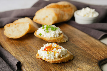 Tasty sandwiches with cottage cheese  on table