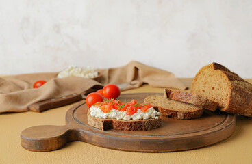 Tasty sandwich with cottage cheese and tomatoes on color background