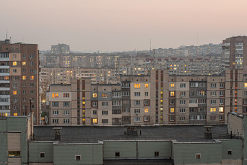 Cityscape of a residential area with Soviet high-rises at twilight. Obukhiv, Kyiv Oblast, Ukraine.