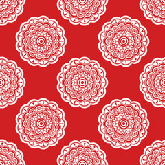 Seamless pattern of mandala flowers on a red background