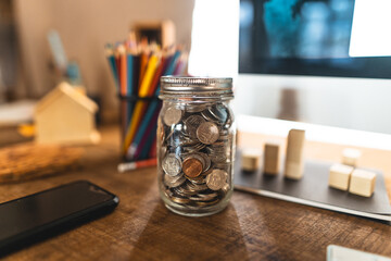 A silver coin in a glass jar