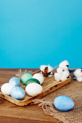 easter eggs wooden board decoration holiday tradition blue background