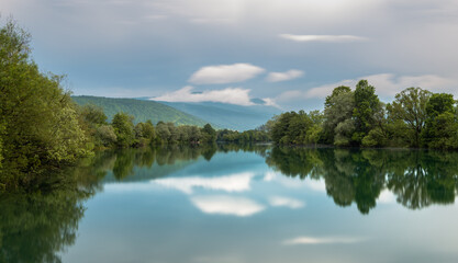Fototapeta na wymiar reflection of trees in river