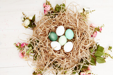 easter eggs in a basket in the form of a nest top view decoration holiday