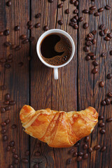 Black coffee and a croissant