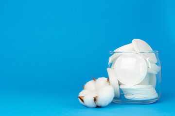Cotton discs for skincare in a jar on paper background