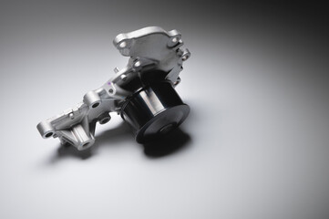 Water pump of the internal combustion engine cooling system. Contrasting on a gray gradient