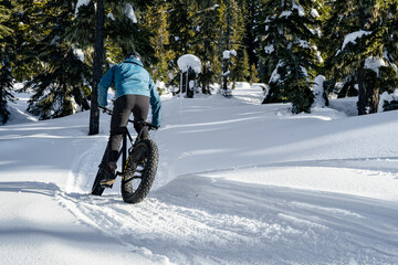 person riding a fat bike in winter