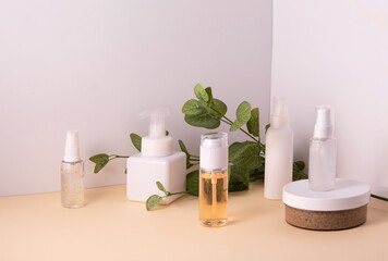Cosmetic containers and skin care products on light background