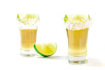 Tequila shots with salted rims and lime slices