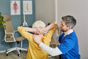 Back treatment and scoliosis correction to elderly. Positive orthopedist doing treatment senior...