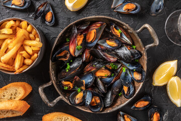 Mussels with potatoes, lemons, and toasted bread, top shot