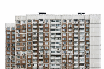 The facade of a multi-storey residential building with many windows. Old houses made of precast concrete. Cheap apartments. Fragment isolated on a white background