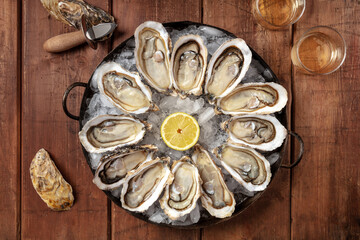 Oysters, overhead flat lay shot with lemon and wine