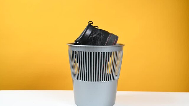 Shoes are thrown into the trash