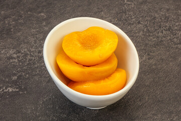 Marinated peaches fruit in the bowl
