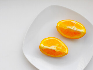 slice of orange. Orange citrus clipping path. Orange fruits. Orange slice on a plate isolated on white background.
