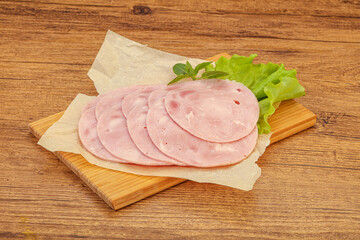 Slised ham snack over board