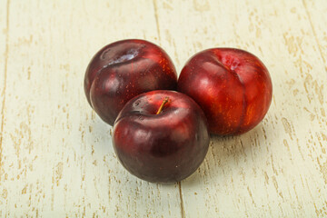 Ripe sweet plum fruit heap