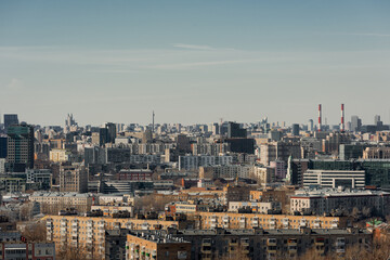 Fototapeta premium Panoramic view of the big city. Roofs of houses to the horizon. Large metropolis