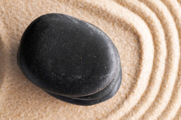 Japanese zen garden with stone in raked sand